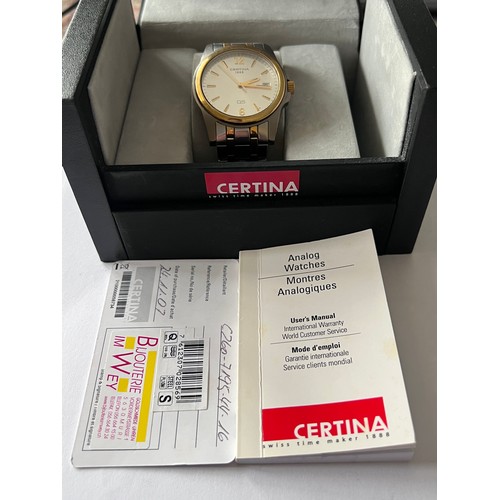 569 - A Certina DS battery operated wristwatch with date aperture on gold and silver coloured bracelet. In... 