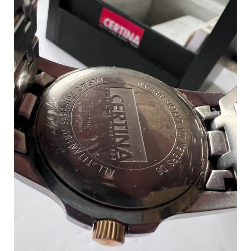 569 - A Certina DS battery operated wristwatch with date aperture on gold and silver coloured bracelet. In... 