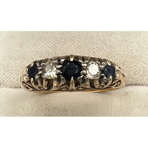 512 - An 18 carat gold ring set with sapphires and diamonds. Size O. Weight 5.5gm.