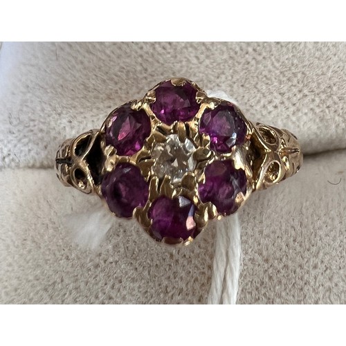 513 - A 9 carat gold ring set with pink and clear stones, size J, weight 2.4gm.