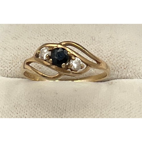 517 - A 9 carat gold ring set with blue and clear stones. Size Q. Weight 1.5gm.