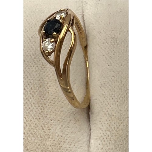 517 - A 9 carat gold ring set with blue and clear stones. Size Q. Weight 1.5gm.