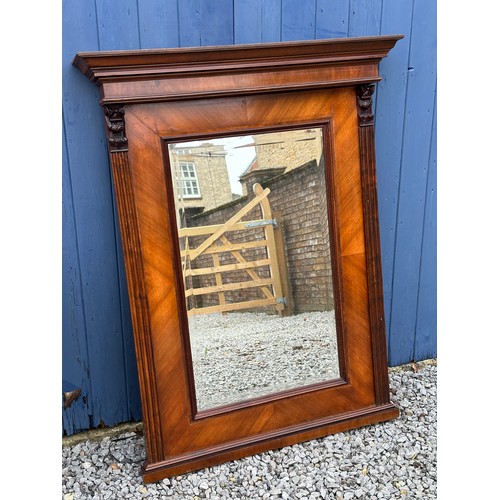 1021 - A mahogany mantel bevel edged mirror. 
123cm h x 95.5cm w.