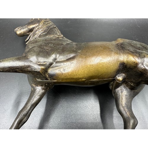 1034 - A bronze horse on a plinth 34cm h, plinth 36.5cm w x 17cm d. No markings.