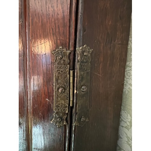 127 - A 19thC double height oak corner cupboard on bracket feet. 205cm h x 60cm w. (glasses not included)