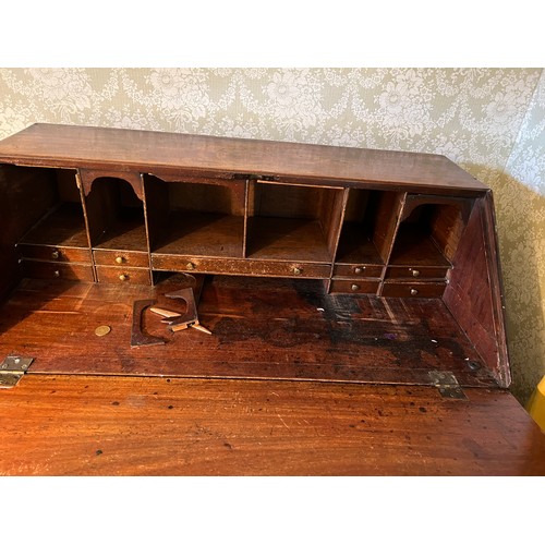 128 - A Georgian mahogany bureau on ogee bracket feet with fluted columns to sides. 94cm w x 103cm h x 50c... 