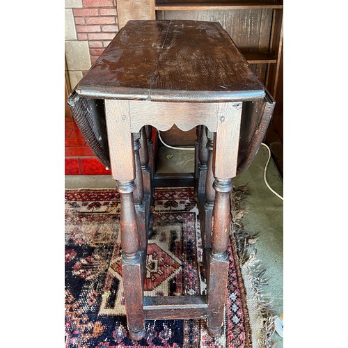 133 - A 19thC oak drop leaf table. 74cm d x 94cm w x 71cm h.