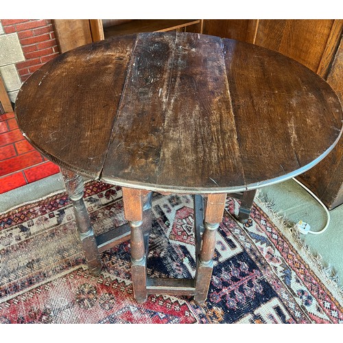 133 - A 19thC oak drop leaf table. 74cm d x 94cm w x 71cm h.