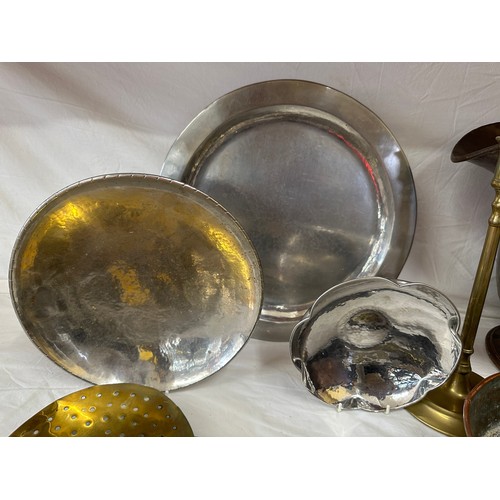 911 - A quantity of brass, copper and pewter ware to include three Keswick School of Industrial Art Firth ... 