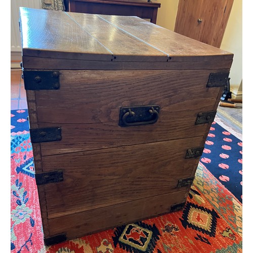 44 - A metal bound oak trunk with metal drop handles to each side and two lift out interior trays. 78cm w... 