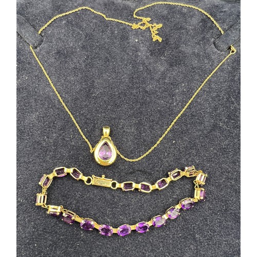 443 - A 9 carat gold and amethyst pendant on 9 carat gold chain, length 44cm, together with an amethyst an... 