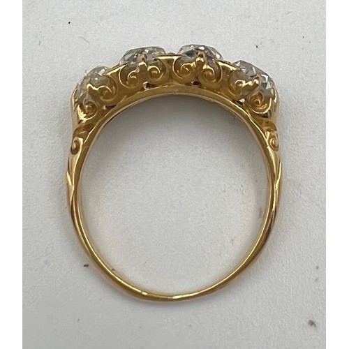 432 - A Victorian 18 carat gold ring set with four old cut diamonds. Total weight of diamonds approximatel... 