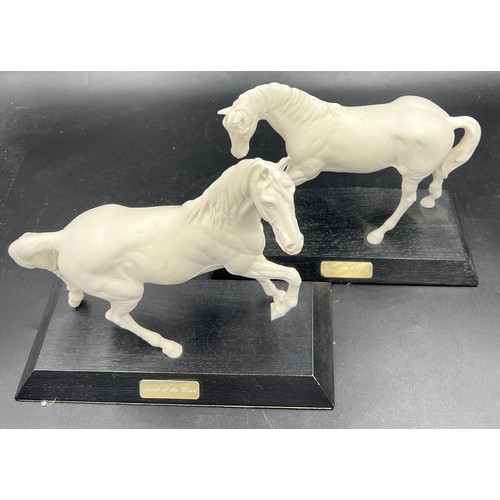 157 - Two Beswick white horses, 24cm h, on wooden plinths. “Spirit of Youth” and “ Spirit of the Wind”.