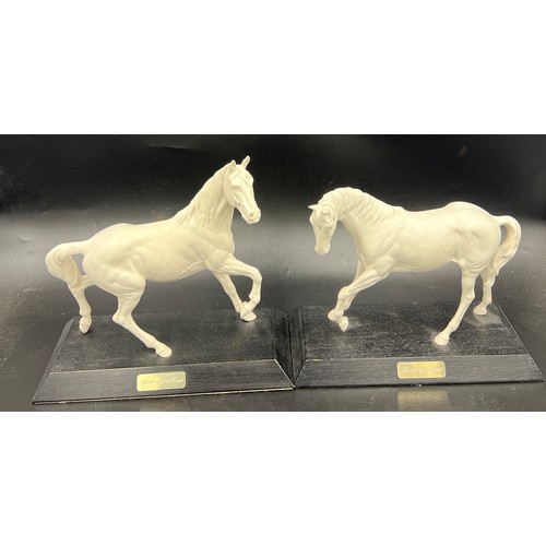 157 - Two Beswick white horses, 24cm h, on wooden plinths. “Spirit of Youth” and “ Spirit of the Wind”.