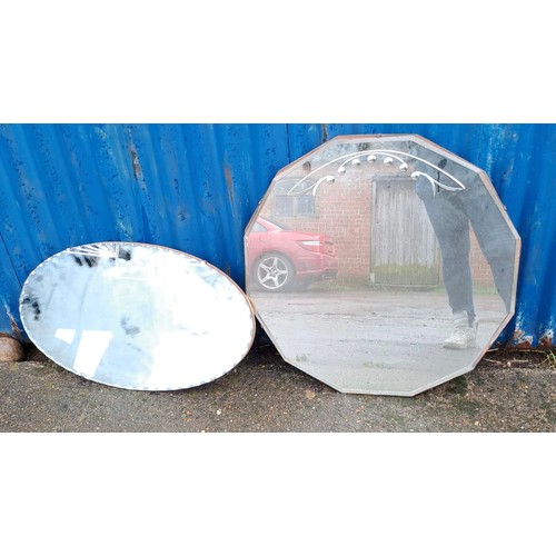 1009 - Two vintage bevelled glass mirrors, one oval 66cm x 38cm.