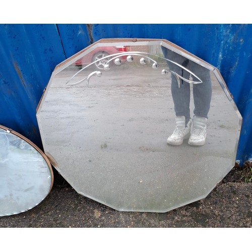 1009 - Two vintage bevelled glass mirrors, one oval 66cm x 38cm.