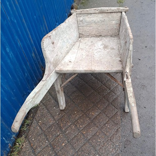 152 - A 19thC wooden wheelbarrow with replacement rubber wheel. 154cm l x 61cm w.