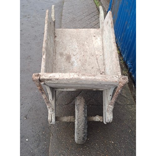 152 - A 19thC wooden wheelbarrow with replacement rubber wheel. 154cm l x 61cm w.