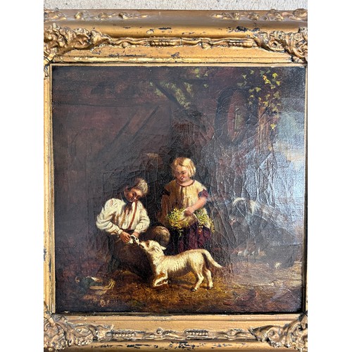 1197 - B.A. Howe, active 1844-57. Oil on canvas stable scene with children feeding a lamb with a dog lookin... 