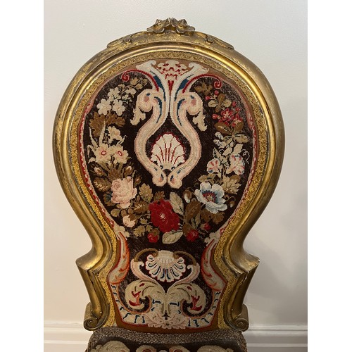 26 - A 19thC giltwood child’s chair with original woolwork tapestry back and seat on cabriole legs. 84cm ... 