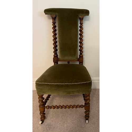 27 - A 19thC walnut prie dieu chair with barley twist stretchers and supports. 104cm h to back.