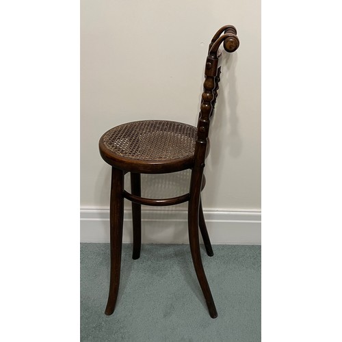 29 - A child’s bentwood high chair with cane seat by Linz of Austria. 88cm h to back.