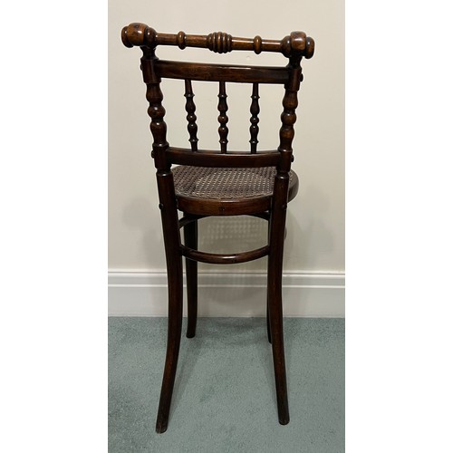 29 - A child’s bentwood high chair with cane seat by Linz of Austria. 88cm h to back.