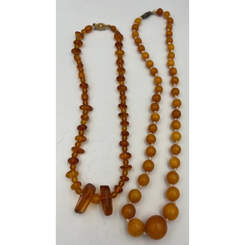 431 - Two strings of amber bead necklaces. Total weight 38.3gm. Approximate lengths 40cm and 50cm.