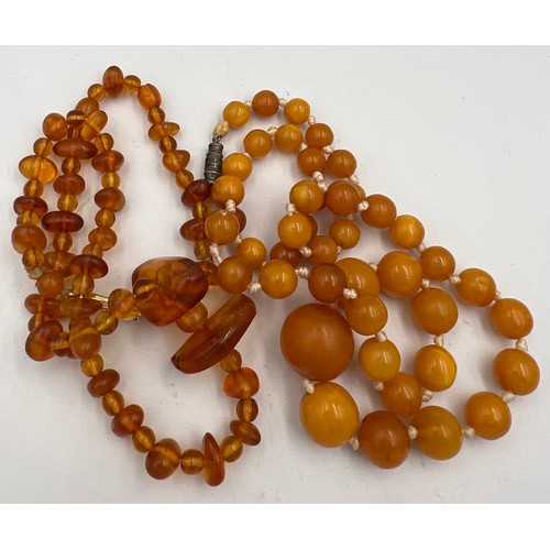 431 - Two strings of amber bead necklaces. Total weight 38.3gm. Approximate lengths 40cm and 50cm.