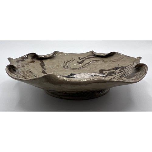 769 - A Japanese Banko ware dish in neriage style agate clay with enamel cranes and gloss glaze. Impressed... 