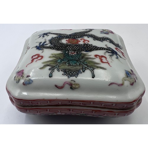 771 - A Chinese small lidded box, flaming pearls and single five clawed dragon with red six character Guan... 