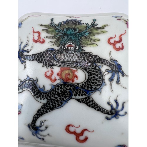 771 - A Chinese small lidded box, flaming pearls and single five clawed dragon with red six character Guan... 