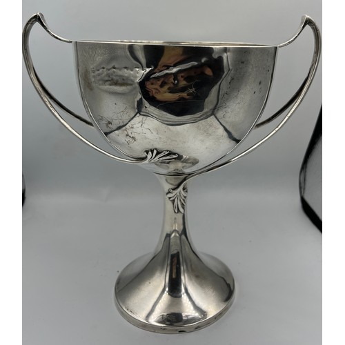 673 - A hallmarked silver cup. London 1925, maker Edward Barnard & Sons Ltd, 22.5cm h. Weight 609gm.