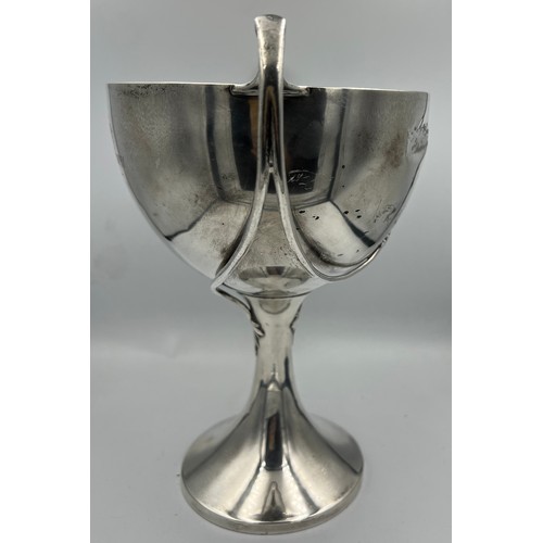 673 - A hallmarked silver cup. London 1925, maker Edward Barnard & Sons Ltd, 22.5cm h. Weight 609gm.