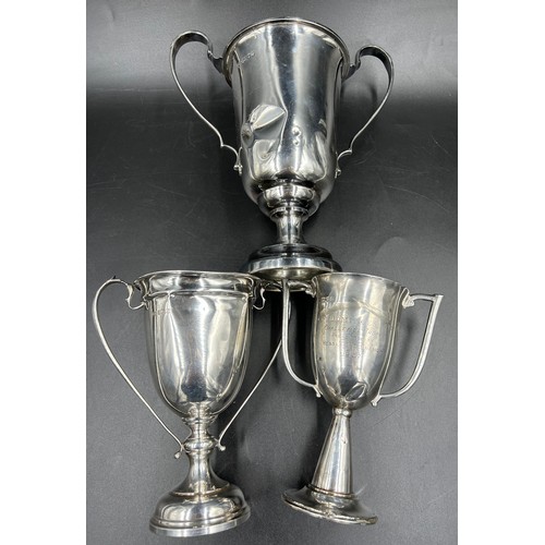 675 - Three hallmarked silver presentation cups. Various dates and makers to include Chester 1939. Total w... 