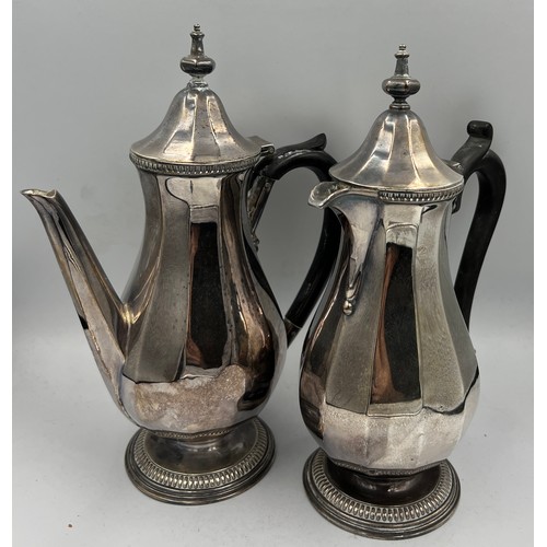 672 - Two silver coffee pots, 22cm h. Sheffield 1931, maker Robert’s & Belk. Total weight 741gm.