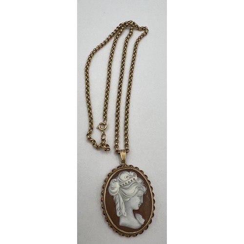 415 - A shell cameo pendant in a 9 carat gold surround suspended on a 9 carat gold chain. Chain length 41c... 