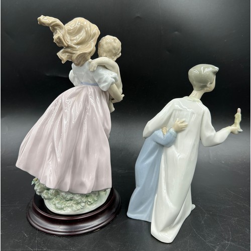 174 - Two Lladro figurines comprising 'Playing Mom' 6681 24cm h in original box, and a group of a young bo... 