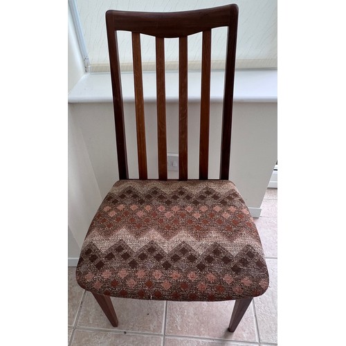 10 - A mid 20thC G plan teak extending dining table and four chairs. Size extended 208cm l x 112cm w x 73... 