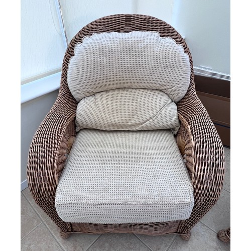 11 - A three piece rattan conservatory suite together with a glass topped occasional table. Chair 101cm h... 