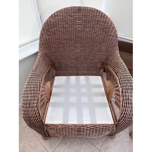 11 - A three piece rattan conservatory suite together with a glass topped occasional table. Chair 101cm h... 