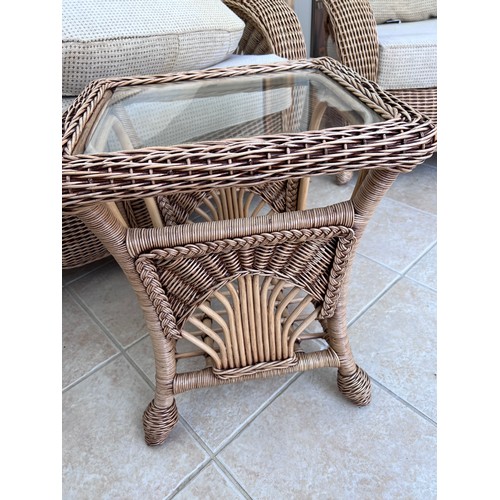 11 - A three piece rattan conservatory suite together with a glass topped occasional table. Chair 101cm h... 