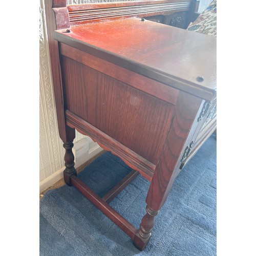 12 - An Old Charm oak telephone table with seat and cupboard to the side. 93cm l x 47cm d x 74cm h.