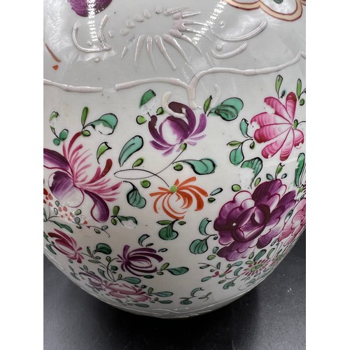 180 - A porcelain lidded vase in the Chinese taste with armorial decoration by Samson of Paris. 29cm h.