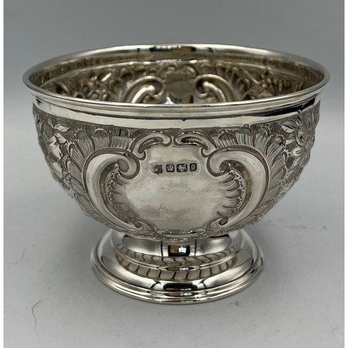 677 - A hallmarked silver bowl with embossed decoration and a vacant cartouche. Sheffield 1899, maker Fent... 