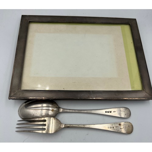 676 - Silver to include frame with engine turned decoration, Birmingham 1926 and a fork and spoon Birmingh... 