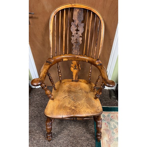 13 - A high backed yew wood Windsor broad arm chair. 110 cm h to back. Bearing name to underside W. Thack... 