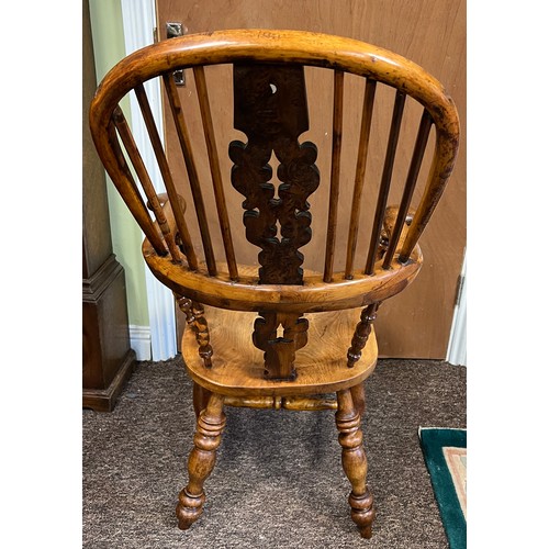 13 - A high backed yew wood Windsor broad arm chair. 110 cm h to back. Bearing name to underside W. Thack... 