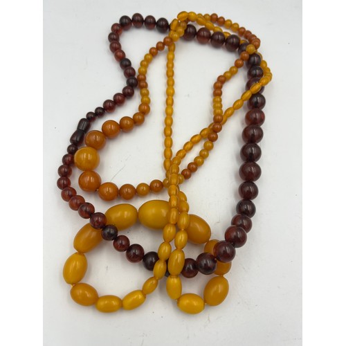 428 - Three strings of amber coloured bead necklaces.