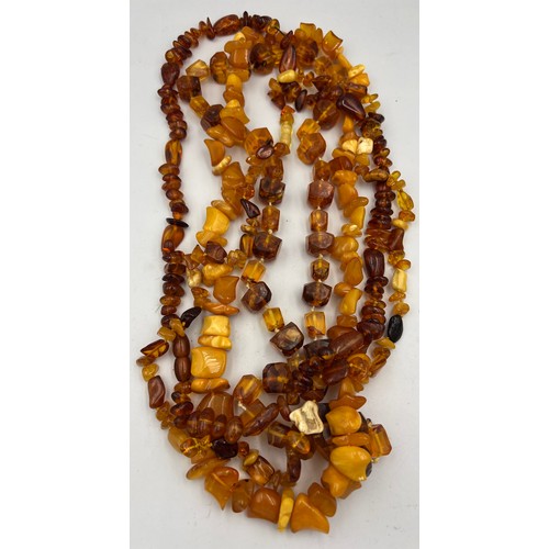 429 - Four amber coloured bead necklaces.